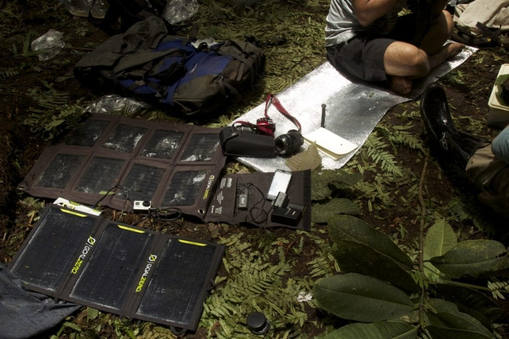 Charging electronic devices using solar energy during a short period of sun. (Photo Maira Duarte).