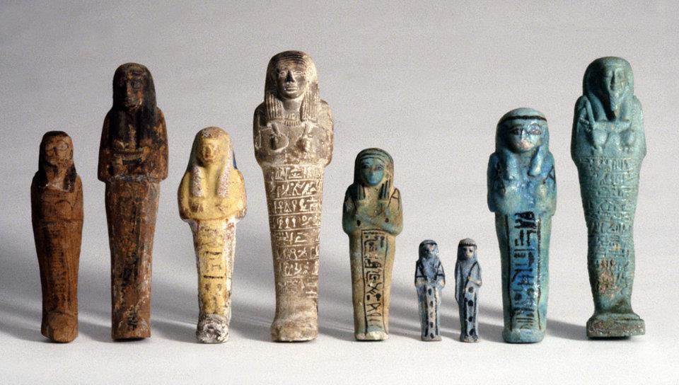 multi-colored shabtis in a row