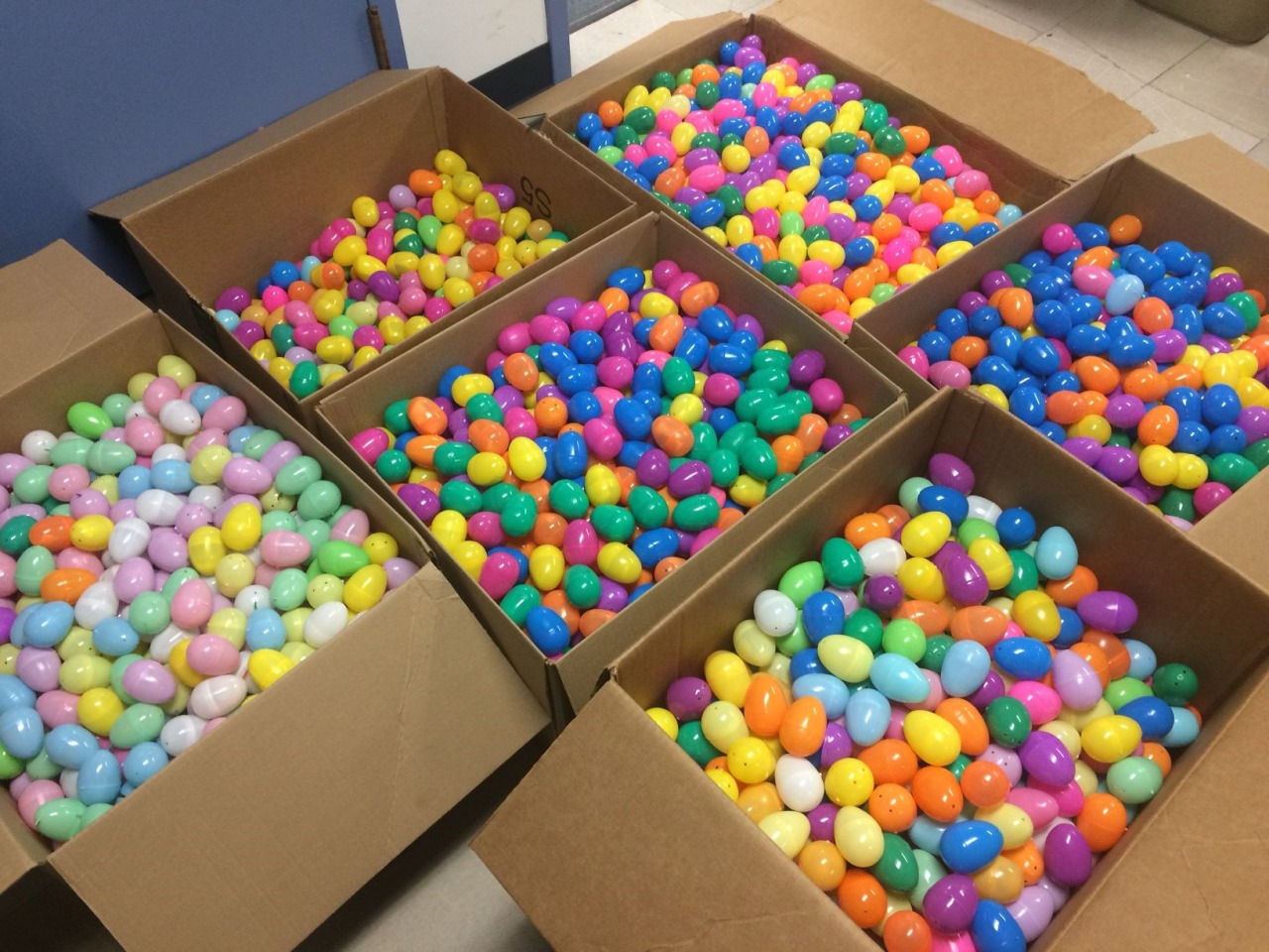 Boxes of colorful plastic eggs