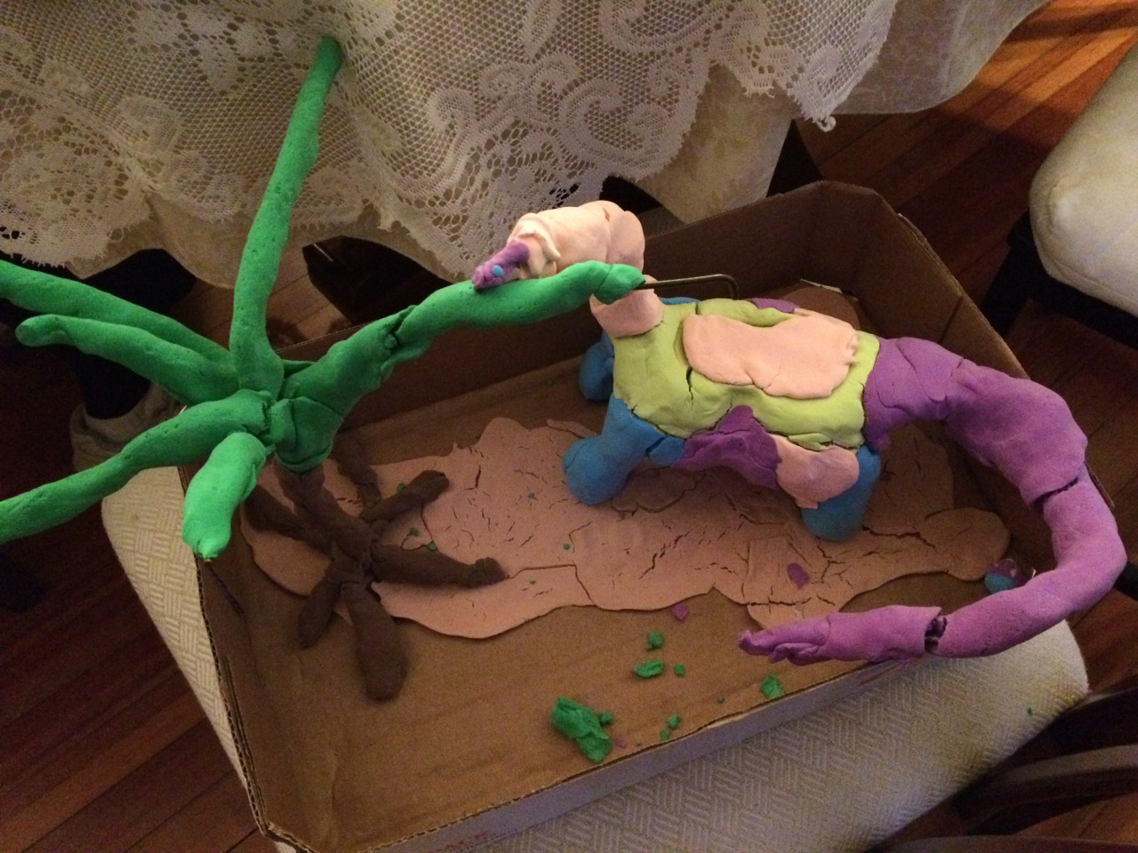 child's clay dinosaur