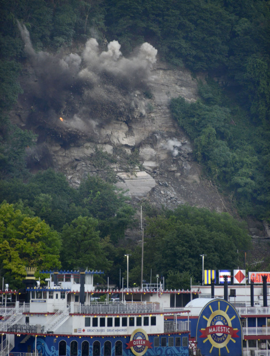 Hillside explosion above a Pittsburgh river boat 