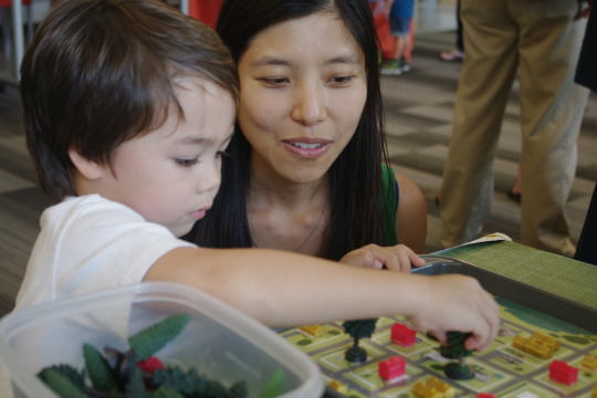 mom and child using an educational kit