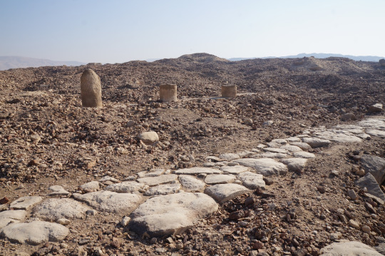 stone path and the remains of three pillars 