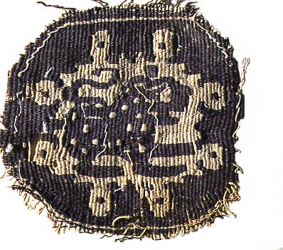 woven decoration in dark brown and light brown thread