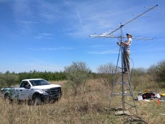 Antenna being put up in a field