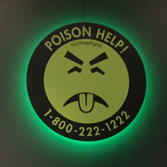 Mr Yuk sticker with a green frownie face and the phone number for the poison help hotline