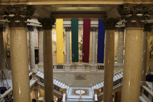 grand staircase decorated with house banners and floating candles