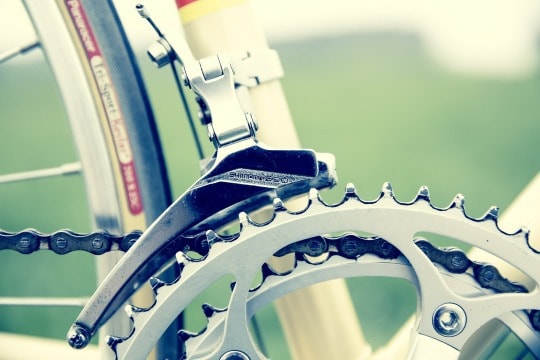 closeup of a bike wheel and gears