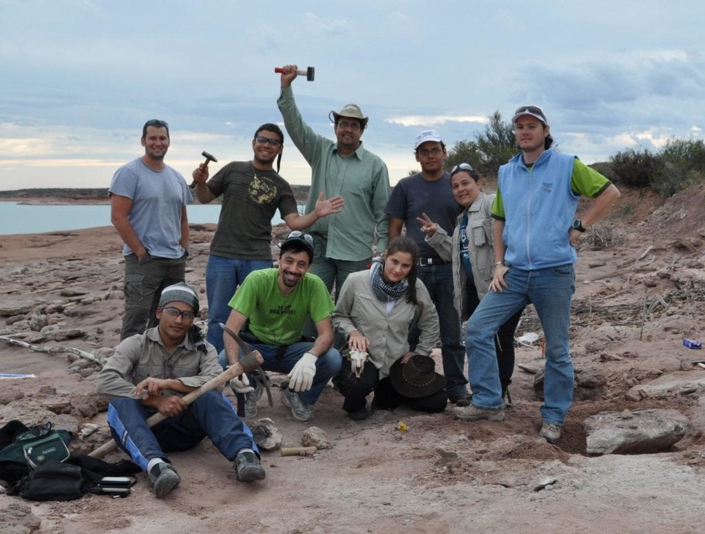 group of researchers at the dig site