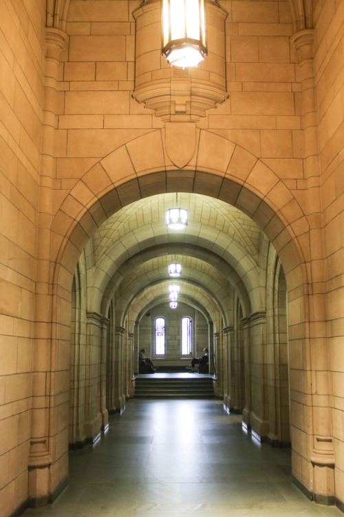 looking down an arched hallway