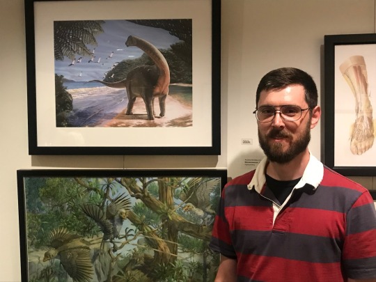 Andrew McAfee with his digital painting of Mansourasaurus 