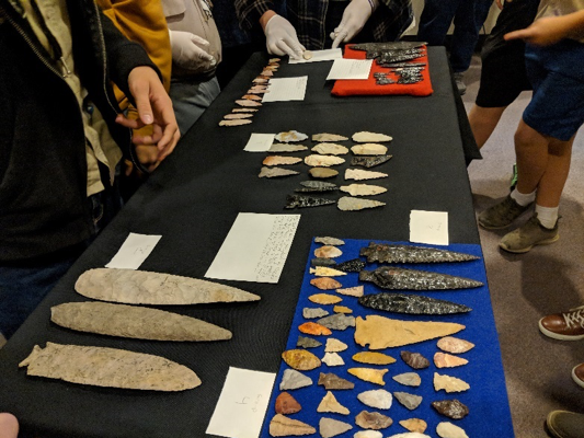 mix of artifacts laid out on a table