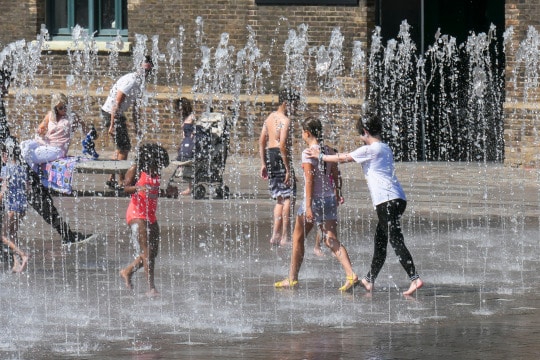 photo of kids playing in a fountain