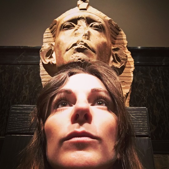 photo of woman's face with Egyptian statue face