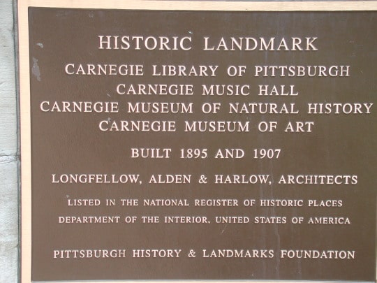 sign that reads Historic Landmark Carnegie Library of Pittsburgh Carnegie Music Hall Carnegie Museum of Natural History Carnegie Museum of Art Built 1895 and 1907 Longellow, Alden & Harlow, Architects Listed in the National Register of Historic Places Department of the Interior, United States of America Pittsburgh History & Landmarks Foundation
