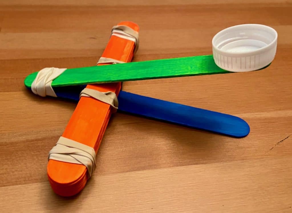 catapult cap stick attached to stacked popsicle stick perpendicularly