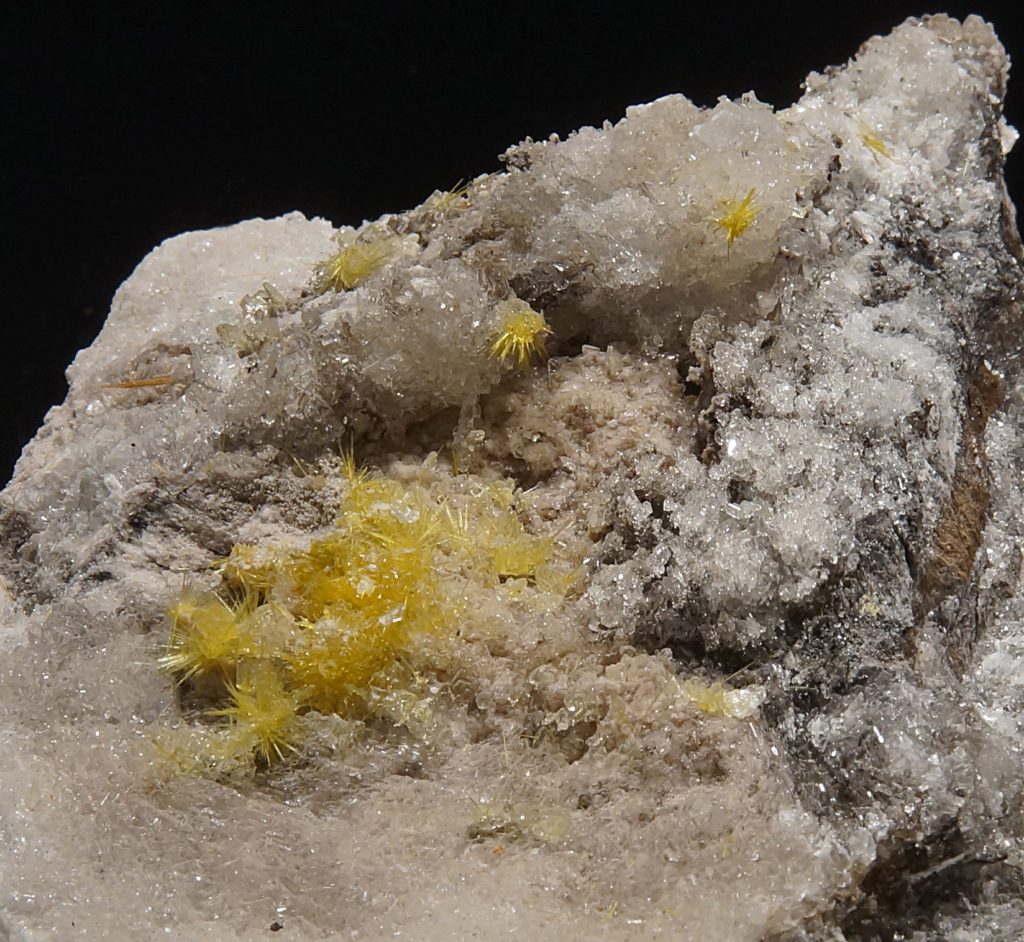 yellow and white mineral specimen