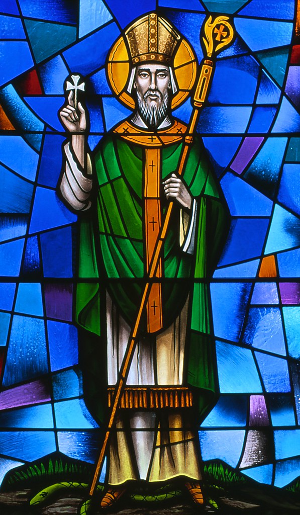 Colorful stained glass window depicting St. Patrick. 