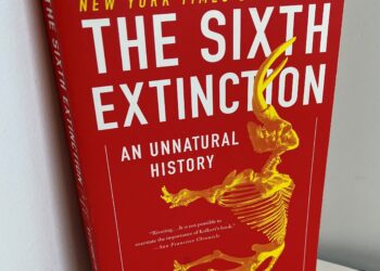 paperback copy of "The Sixth Extinction"