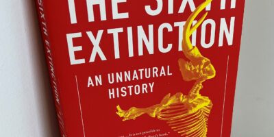paperback copy of "The Sixth Extinction"