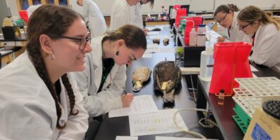 college students working with study skins in a lab
