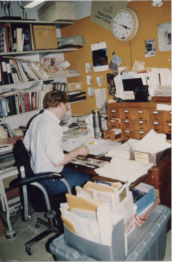 Pat McShea working at a desk