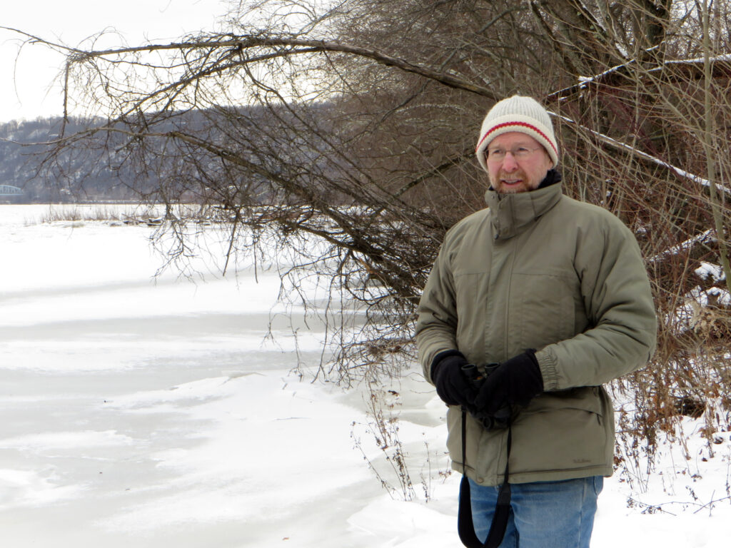 Pat McShea next to an icy river