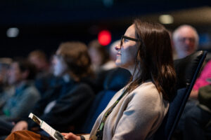 person in the audience of a lecture