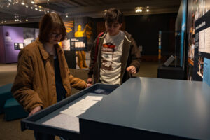 two people looking at a museum exhibit