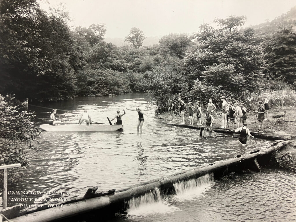 black and white photo of people in the stream at Powdermill
